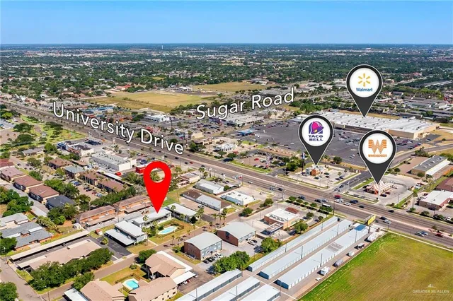an aerial view of a house with a ocean view