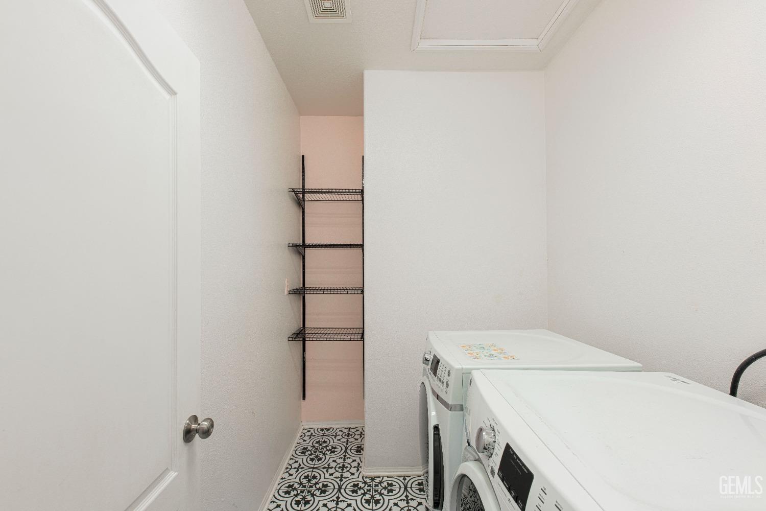 Undisclosed Address Bakersfield, CA 93312 - Photo 19 of 44 a utility room with dryer and washer