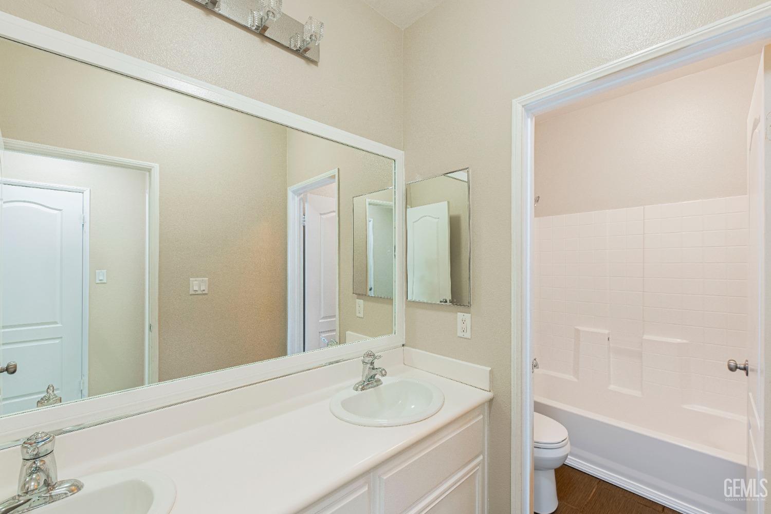 Undisclosed Address Bakersfield, CA 93312 - Photo 20 of 44 a bathroom with a sink and a mirror