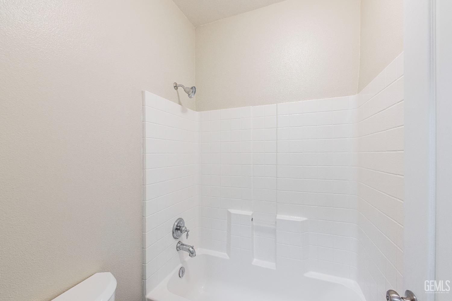Undisclosed Address Bakersfield, CA 93312 - Photo 21 of 44 a bathroom with a bathtub