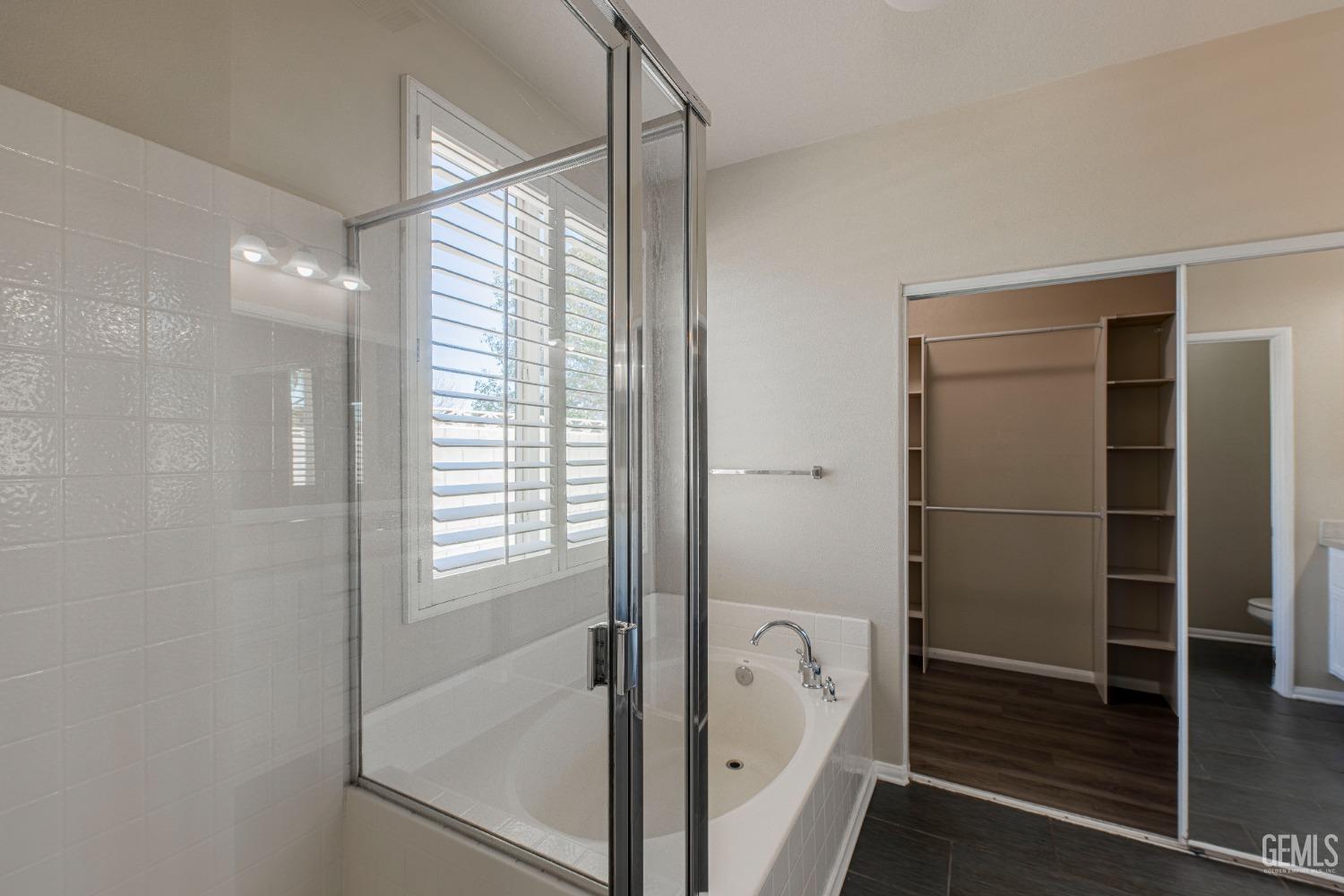 Undisclosed Address Bakersfield, CA 93312 - Photo 31 of 44 a bathroom with a tub and a shower