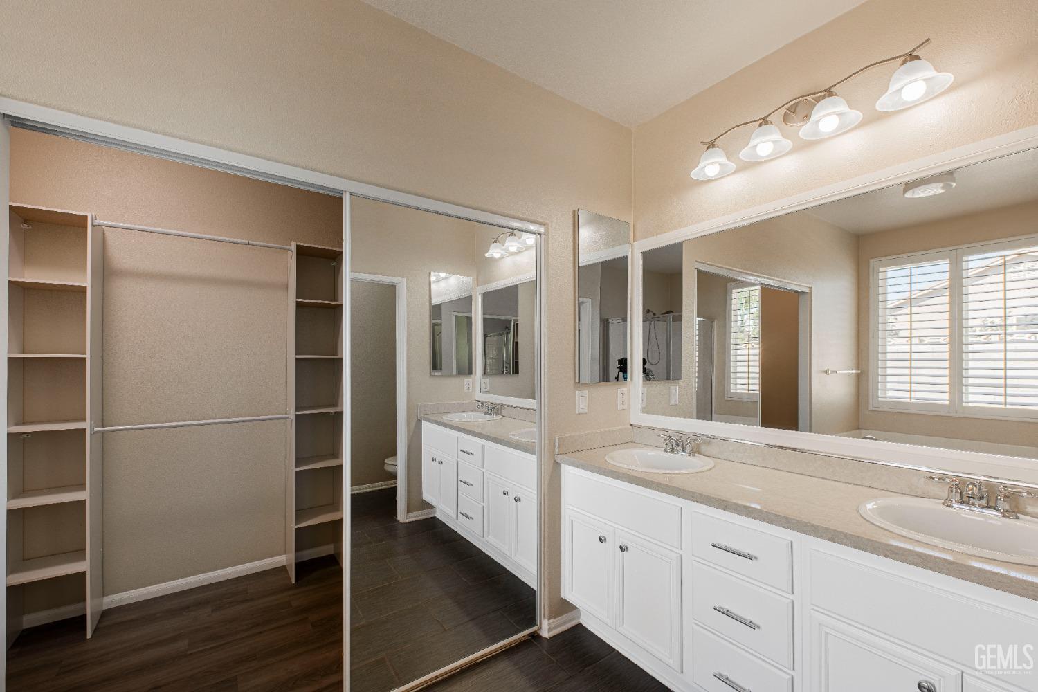 Undisclosed Address Bakersfield, CA 93312 - Photo 32 of 44 a bathroom with a granite countertop sink mirror and double