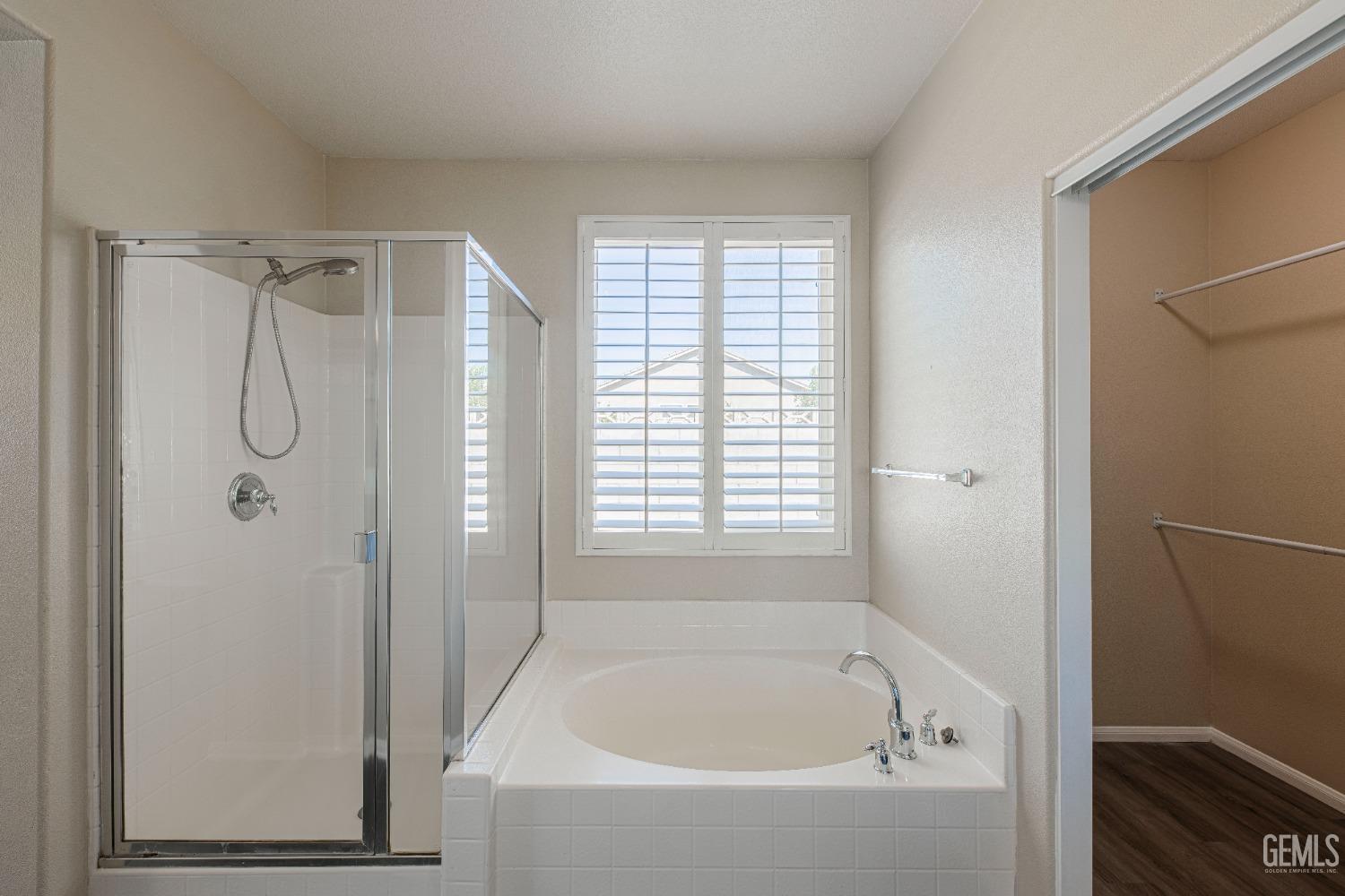 Undisclosed Address Bakersfield, CA 93312 - Photo 33 of 44 a bathroom with a bath tub and a shower