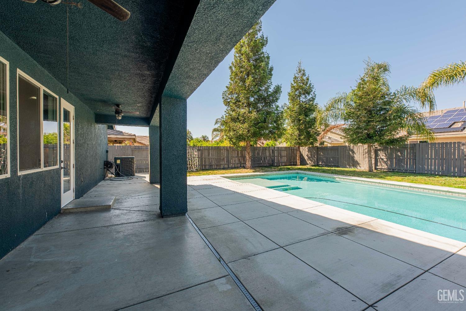 Undisclosed Address Bakersfield, CA 93312 - Photo 34 of 44 a view of a house with backyard and tree