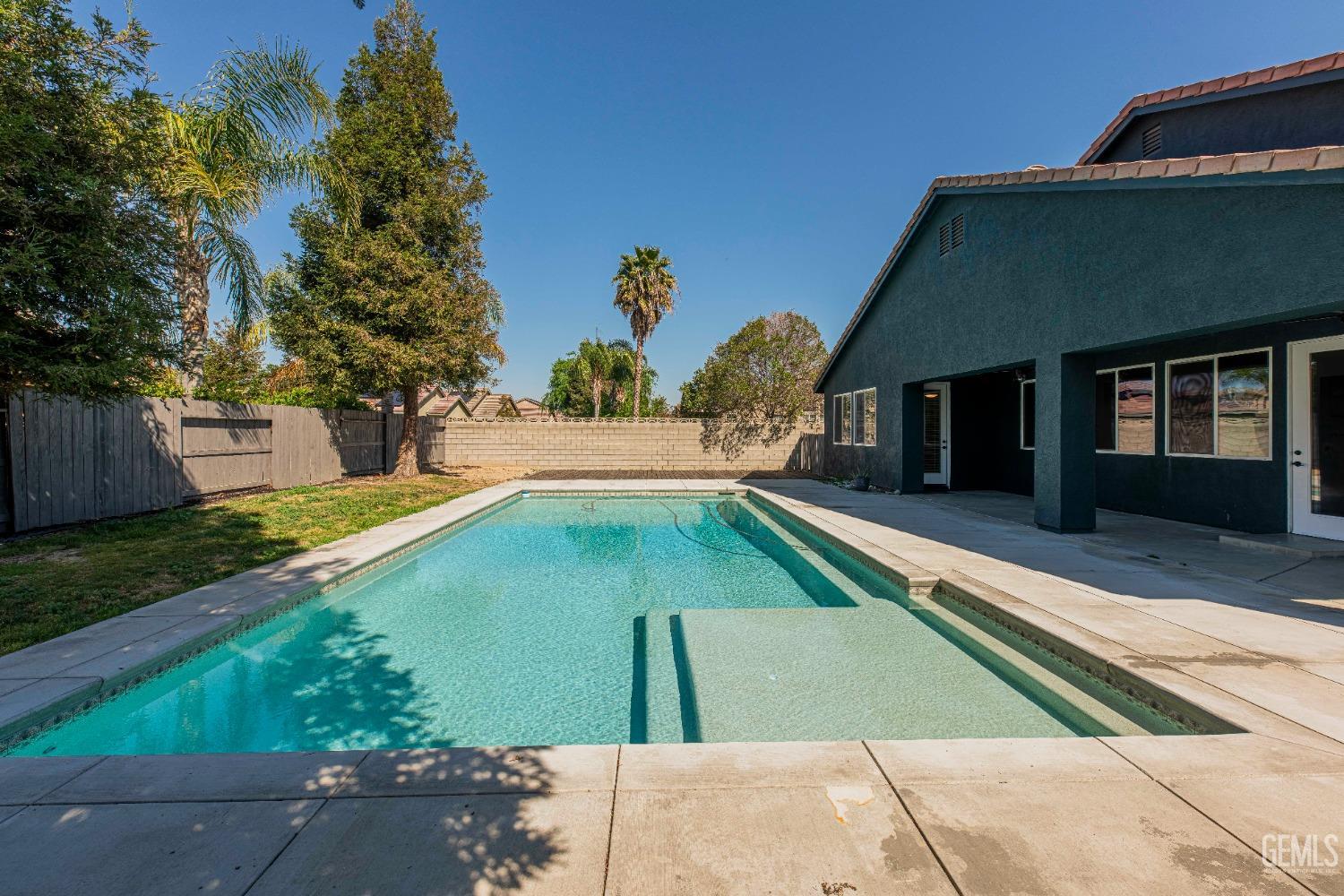 Undisclosed Address Bakersfield, CA 93312 - Photo 37 of 44 a front view of a house with garden