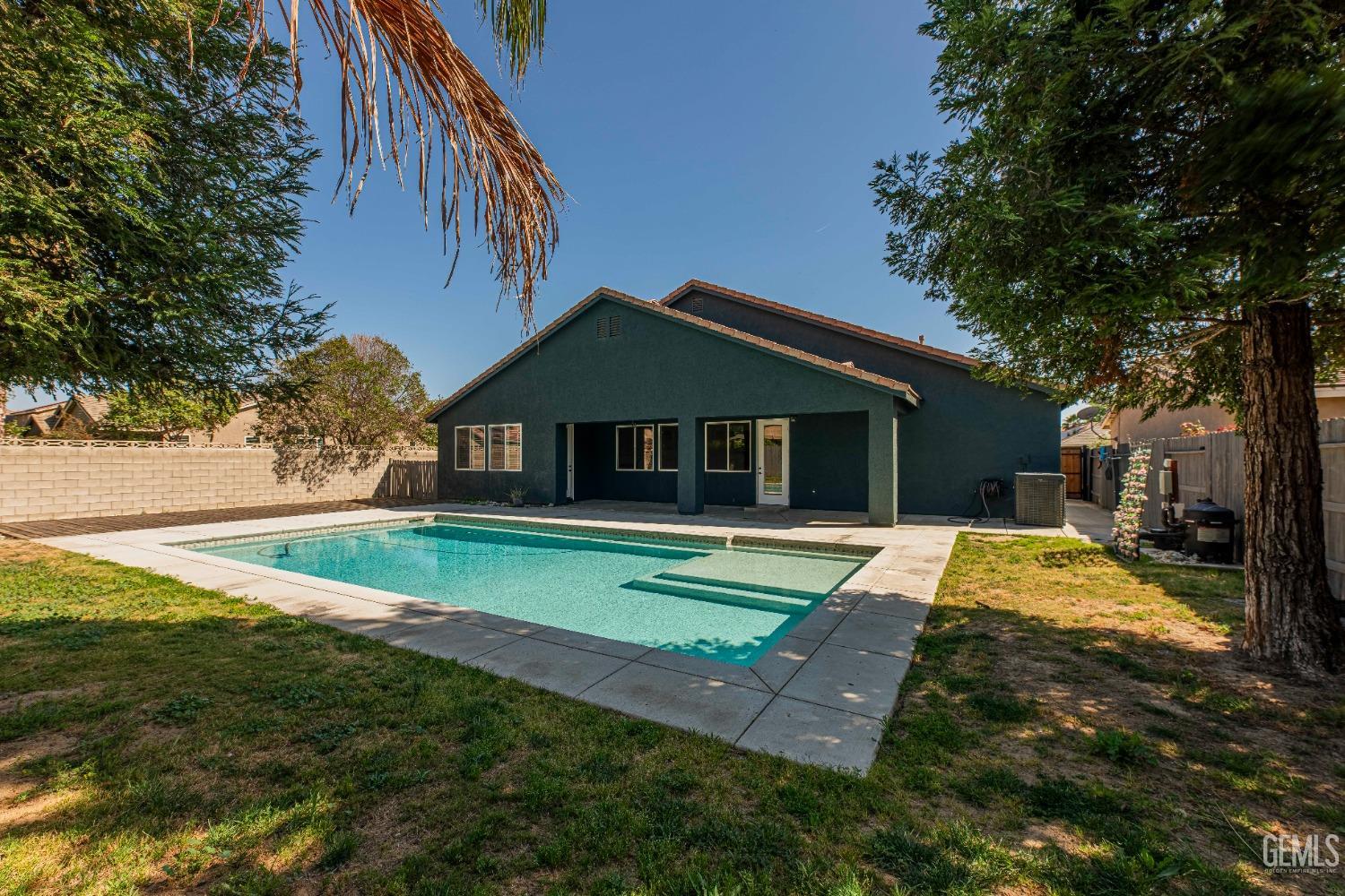 Undisclosed Address Bakersfield, CA 93312 - Photo 38 of 44 a house that has sitting area and garden