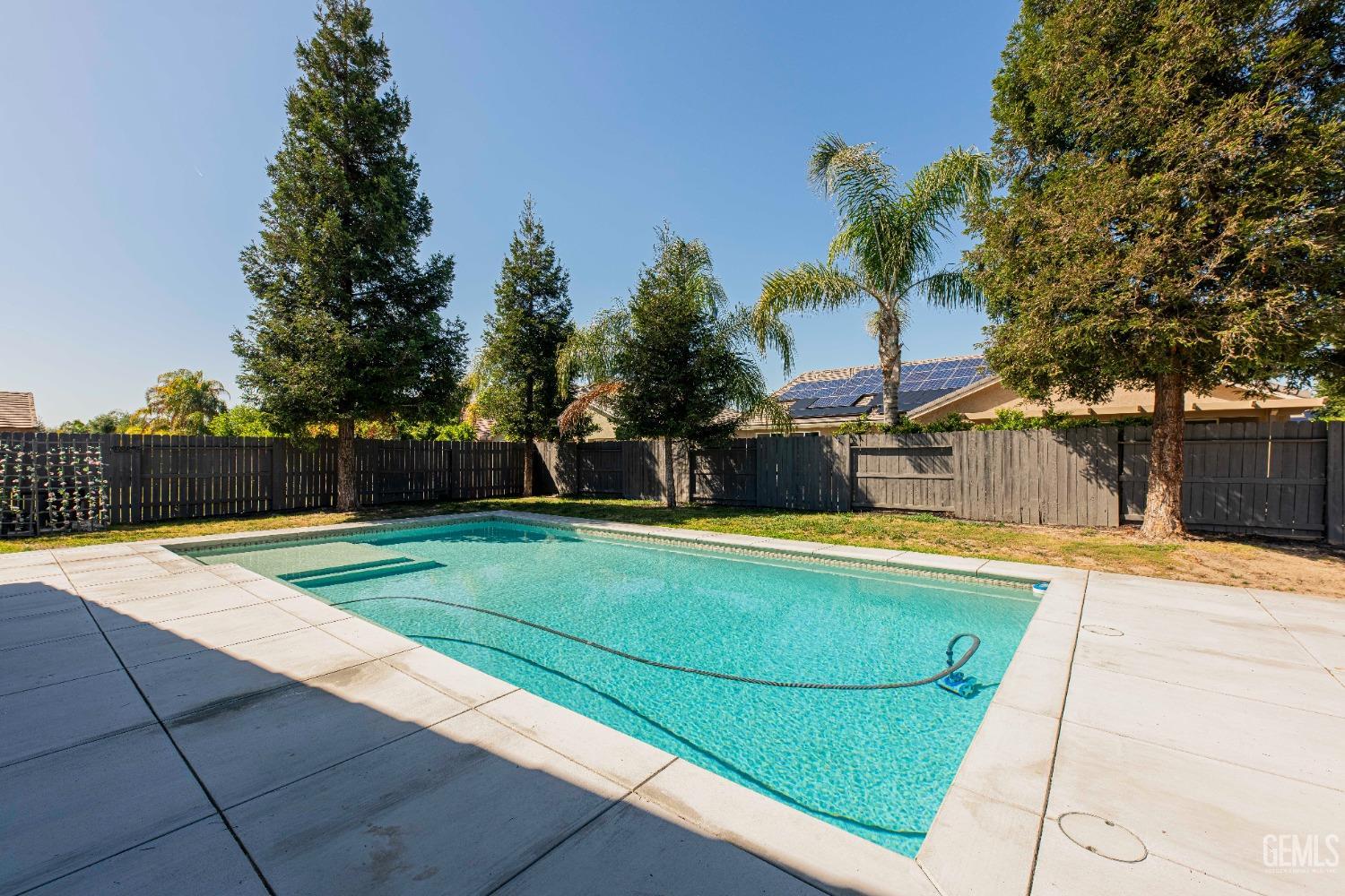 Undisclosed Address Bakersfield, CA 93312 - Photo 42 of 44 a view of a swimming pool with a yard