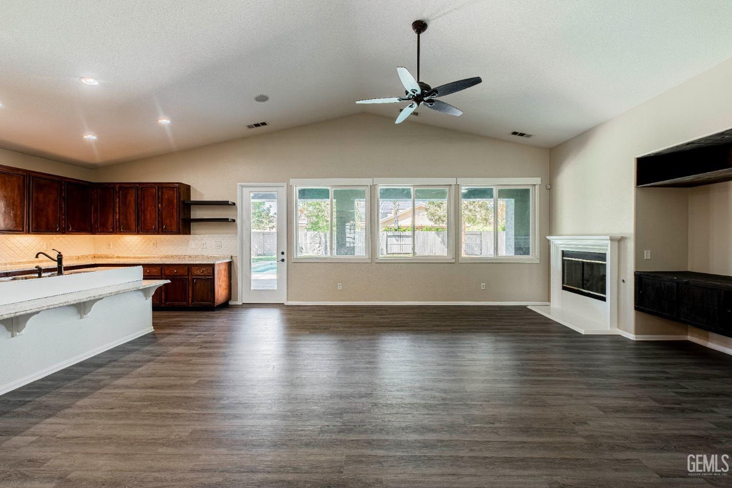 Undisclosed Address Bakersfield, CA 93312 - Photo 8 of 44 a view of kitchen with sink a microwave and cabinets