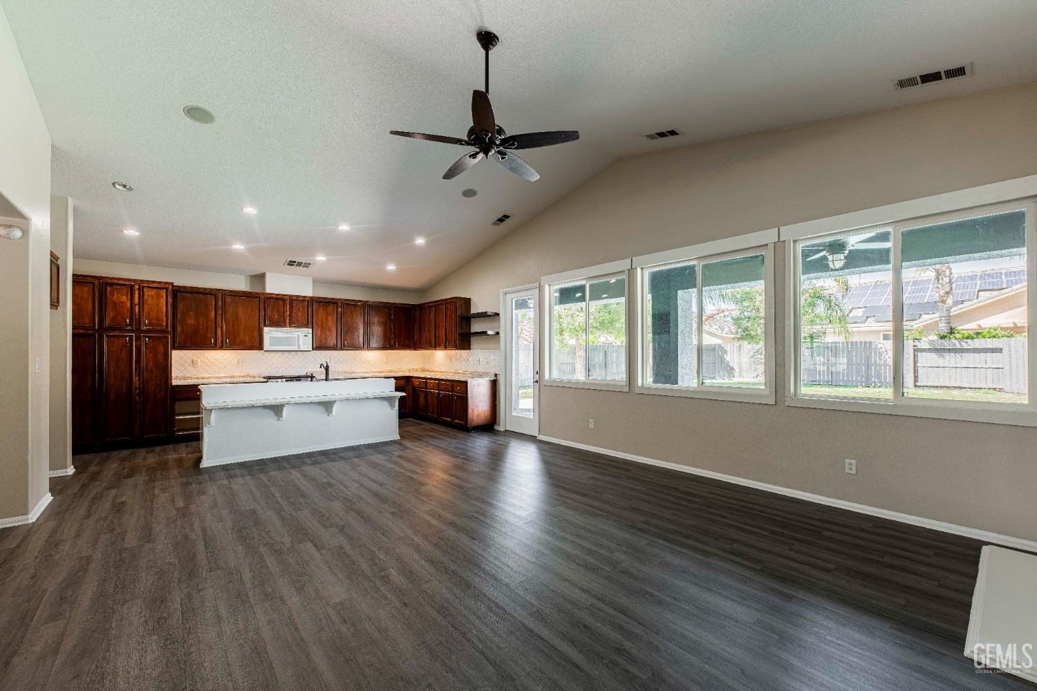 Undisclosed Address Bakersfield, CA 93312 - Photo 9 of 44 a view of a kitchen with furniture wooden floor and window