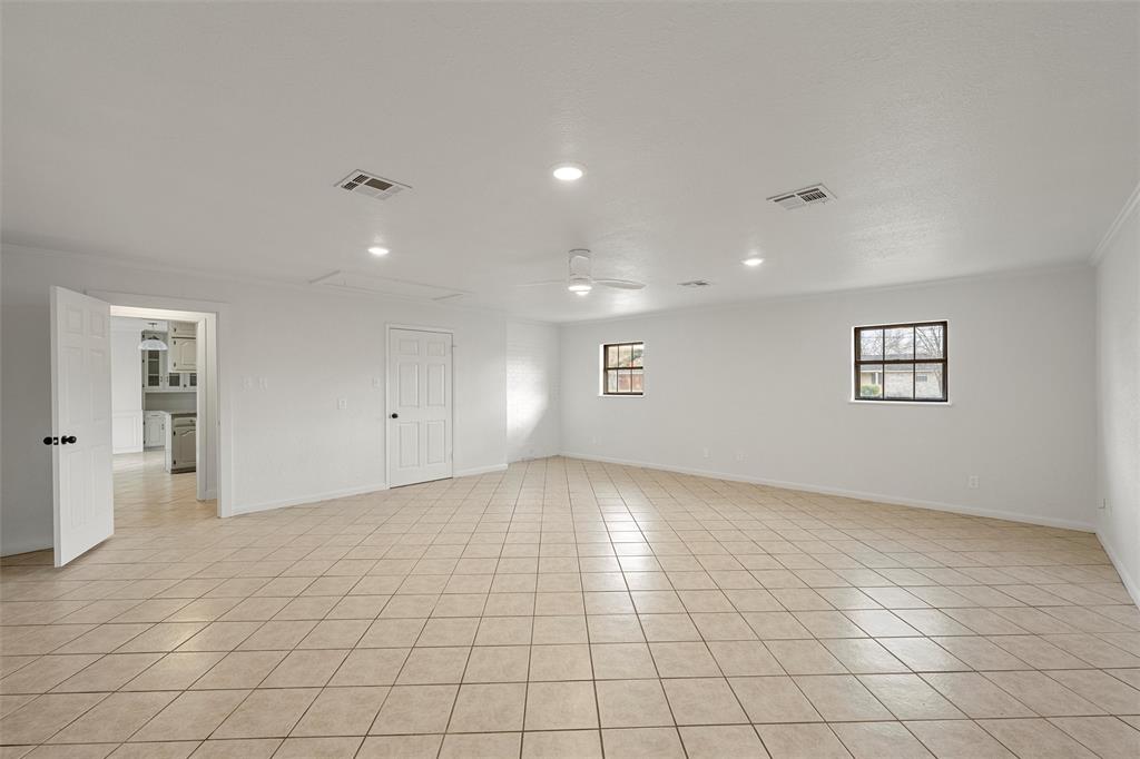 608 South Colorado Street Whitney, TX 76692 - Photo 15 of 26 an empty room with white walls and windows