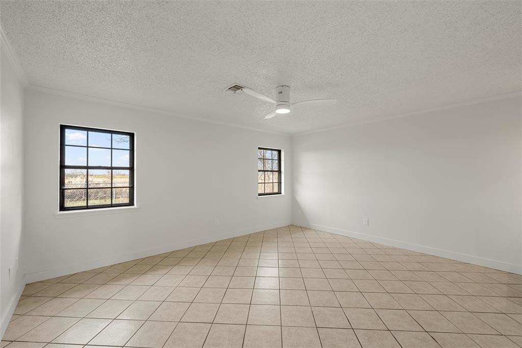 608 South Colorado Street Whitney, TX 76692 - Photo 17 of 26 an empty room with windows