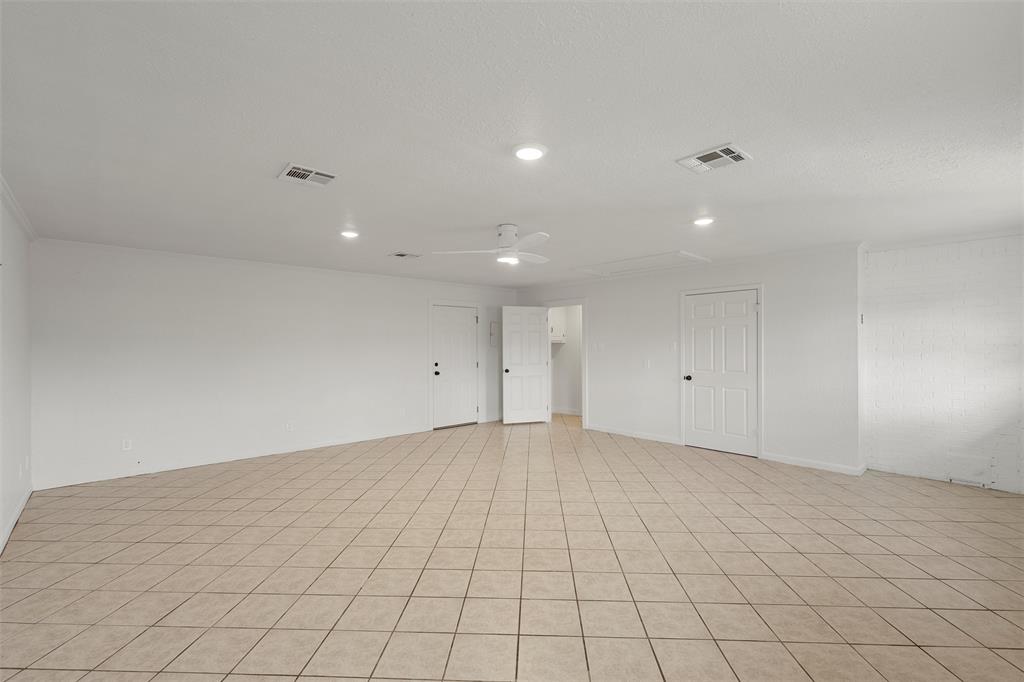 608 South Colorado Street Whitney, TX 76692 - Photo 17 of 27 an empty room with white walls and tiles