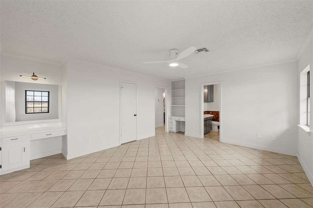 608 South Colorado Street Whitney, TX 76692 - Photo 18 of 26 a view of an empty room with window and cabinet