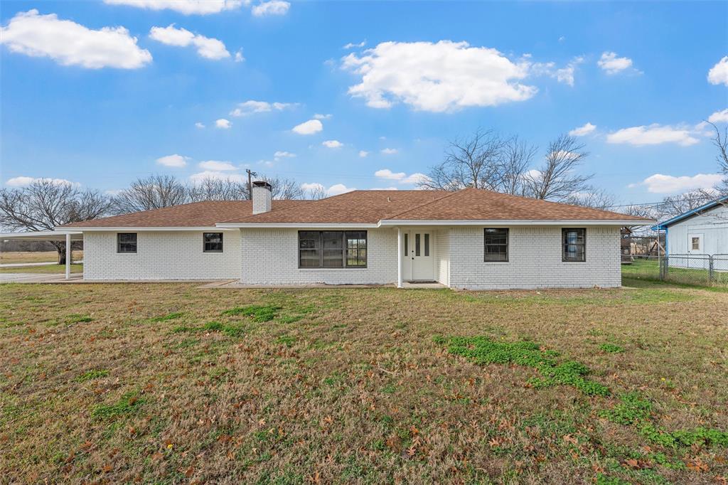 608 South Colorado Street Whitney, TX 76692 - Photo 2 of 27 a view of a house with a backyard