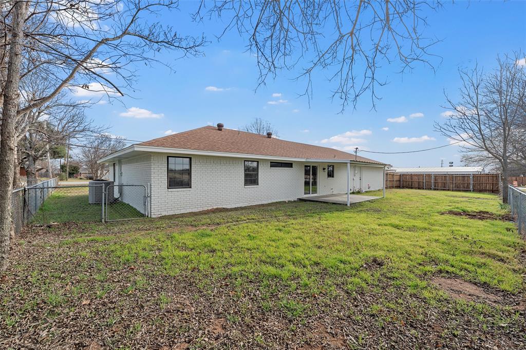 608 South Colorado Street Whitney, TX 76692 - Photo 23 of 27 a view of a house with a backyard