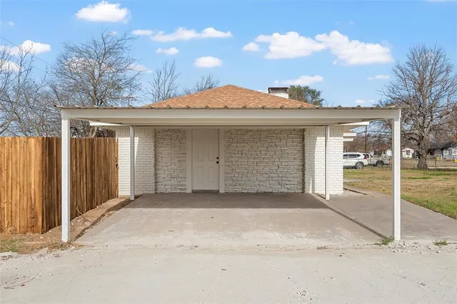 a front view of a house with a garage