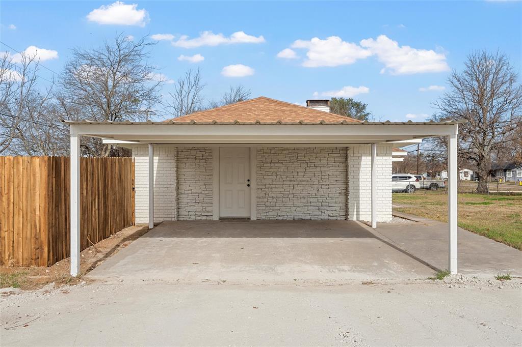 608 South Colorado Street Whitney, TX 76692 - Photo 25 of 27 a front view of a house with a garage