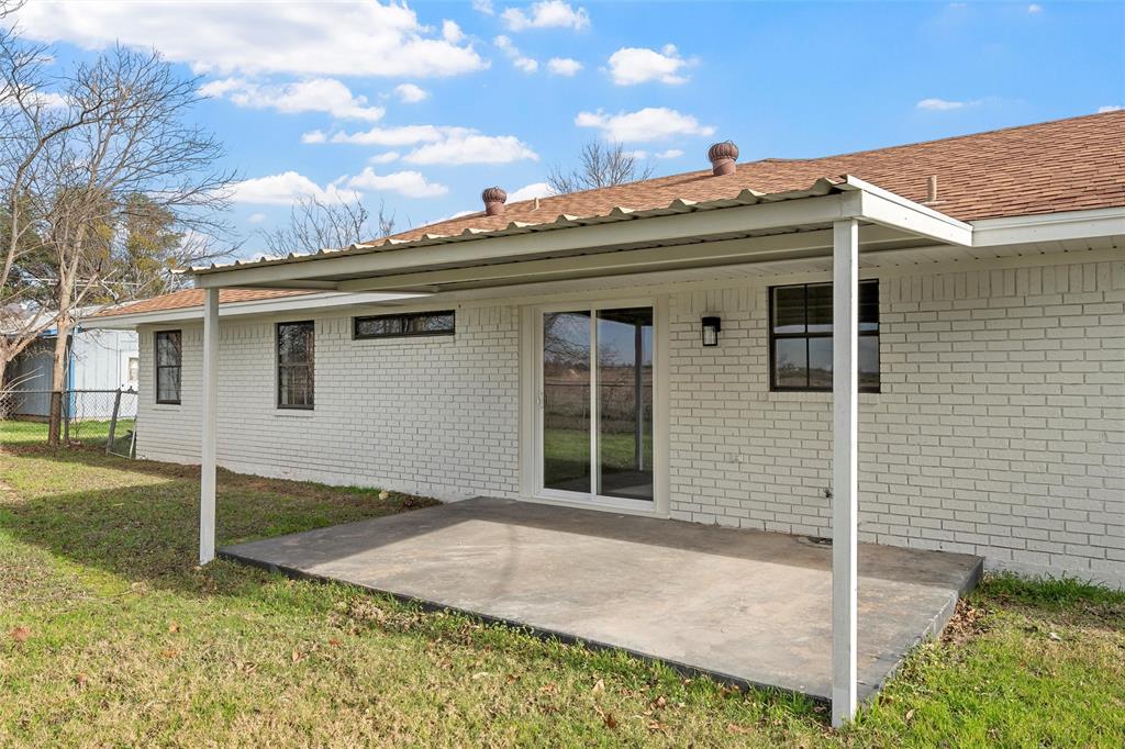 608 South Colorado Street Whitney, TX 76692 - Photo 26 of 27 front view of a house with a yard