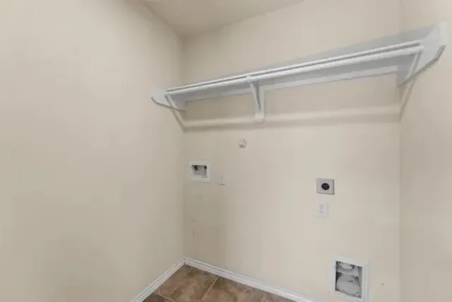 a bathroom with a granite countertop double vanity sink a toilet a mirror and shower