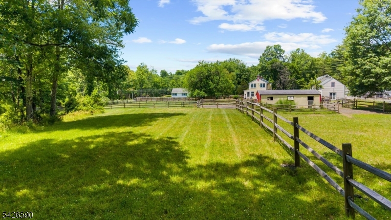 179 Lindbergh Road Hopewell, NJ 08525 - Photo 39 of 46 a view of a swimming pool with an outdoor seating and a yard