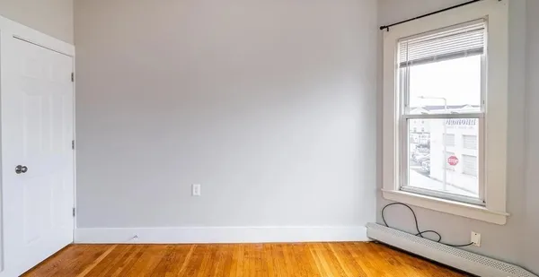 a bathroom with a bathtub and window