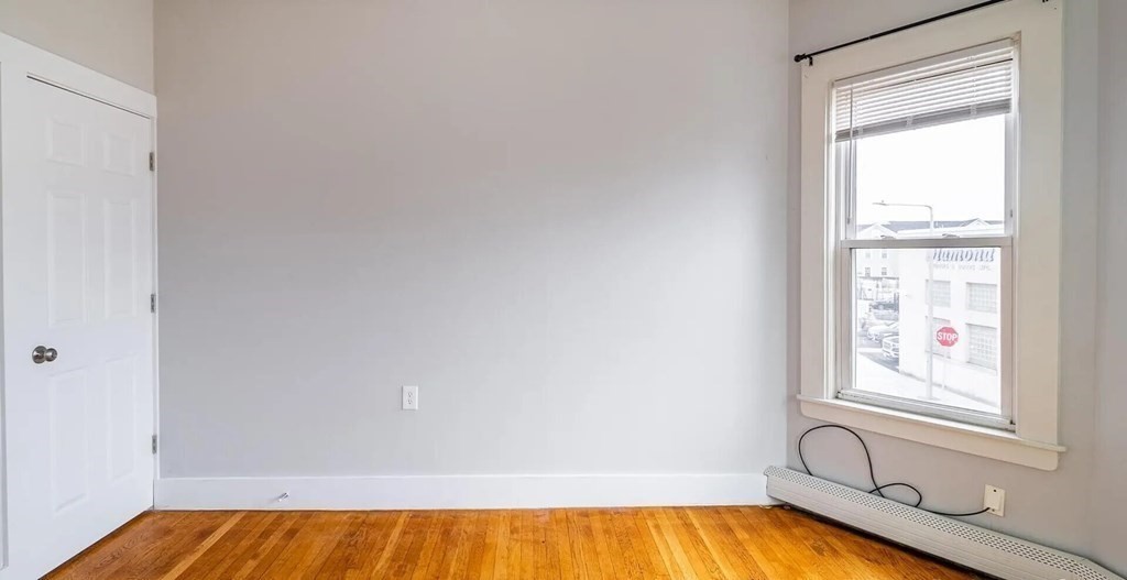 96 East Cottage Street, Unit 2 Boston, MA 02125 - Photo 11 of 15 a bathroom with a bathtub and window