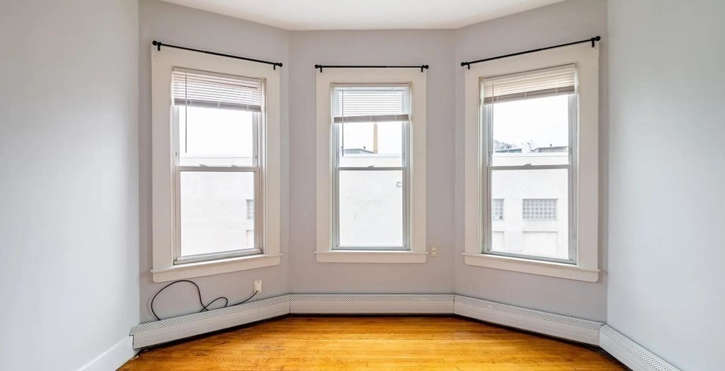 96 East Cottage Street, Unit 2 Boston, MA 02125 - Photo 7 of 15 a view of a room with windows