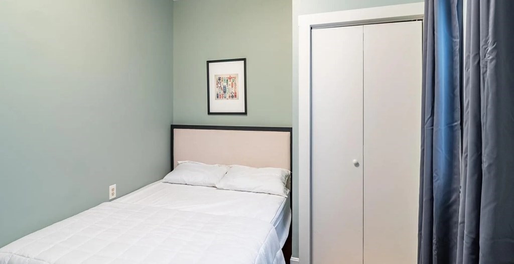 96 East Cottage Street, Unit 2 Boston, MA 02125 - Photo 9 of 15 a bed room with a bed