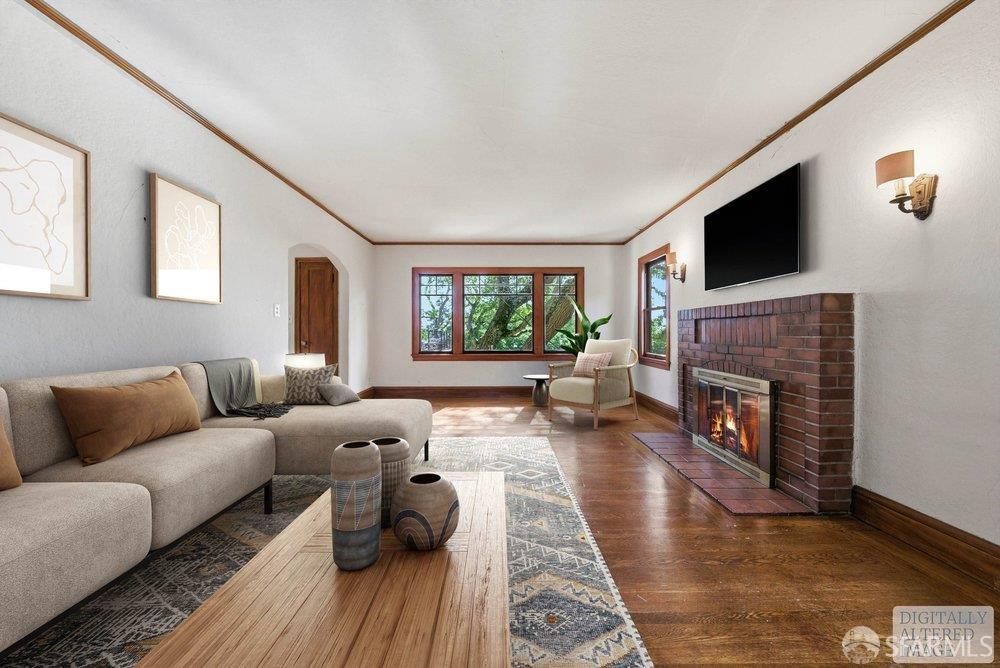 451 Vincente Avenue Berkeley, CA 94707 - Photo 12 of 66 a living room with furniture a flat screen tv and a fireplace