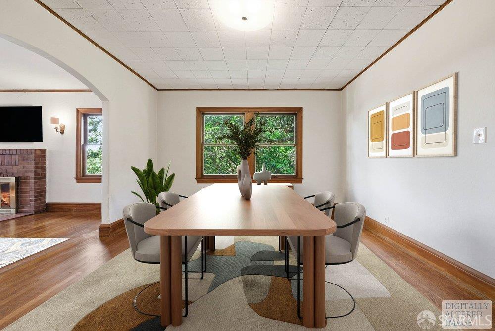 451 Vincente Avenue Berkeley, CA 94707 - Photo 16 of 66 a view of a dining room with furniture window and wooden floor