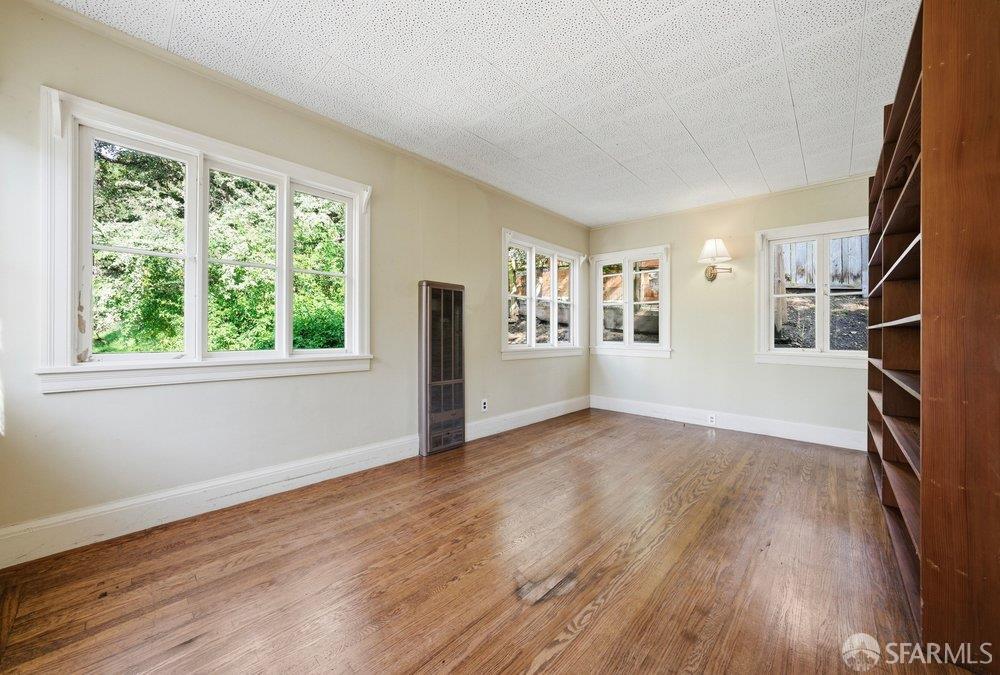 451 Vincente Avenue Berkeley, CA 94707 - Photo 31 of 66 a view of empty room with wooden floor and fan