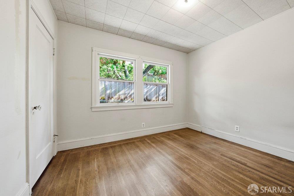 451 Vincente Avenue Berkeley, CA 94707 - Photo 38 of 66 a view of room with window and wooden floor