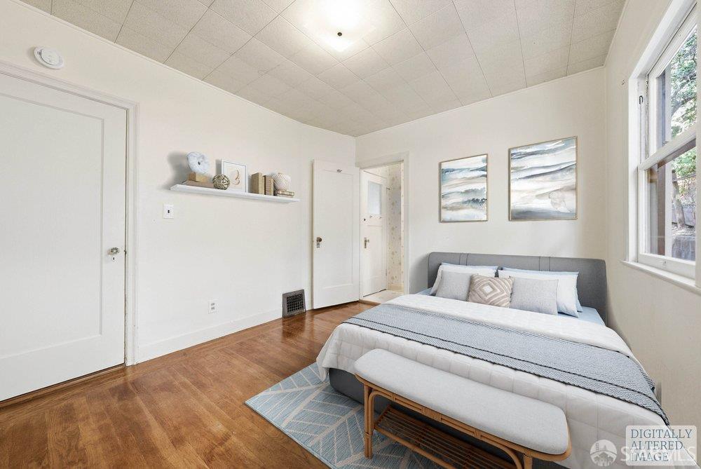 451 Vincente Avenue Berkeley, CA 94707 - Photo 43 of 66 a bedroom with a bed and a window