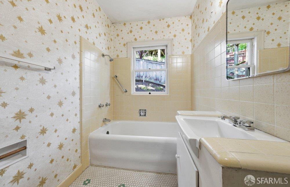 451 Vincente Avenue Berkeley, CA 94707 - Photo 45 of 66 a bathroom with a bathtub and sink