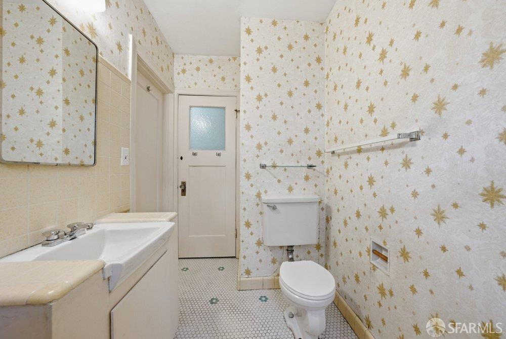 451 Vincente Avenue Berkeley, CA 94707 - Photo 46 of 66 a bathroom with a sink a toilet and a mirror