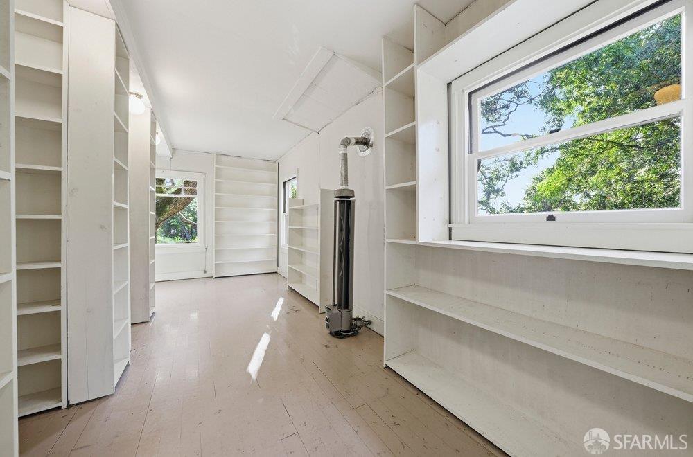 451 Vincente Avenue Berkeley, CA 94707 - Photo 52 of 66 wooden floor in an empty room with a window