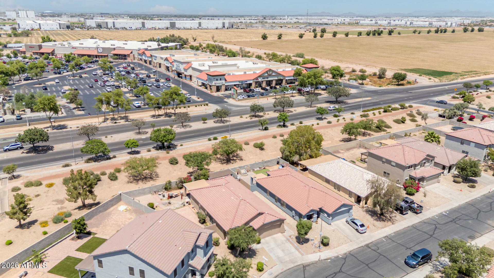 9730 West Payson Road Tolleson, AZ 85353 - Photo 40 of 57 an aerial view of residential building and lake view