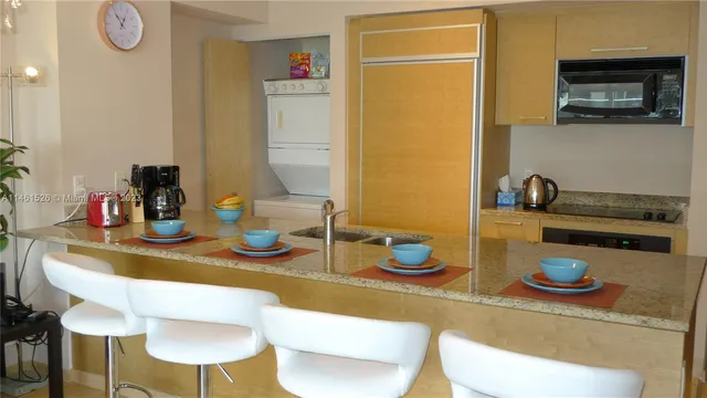 a kitchen with a table and chairs in it