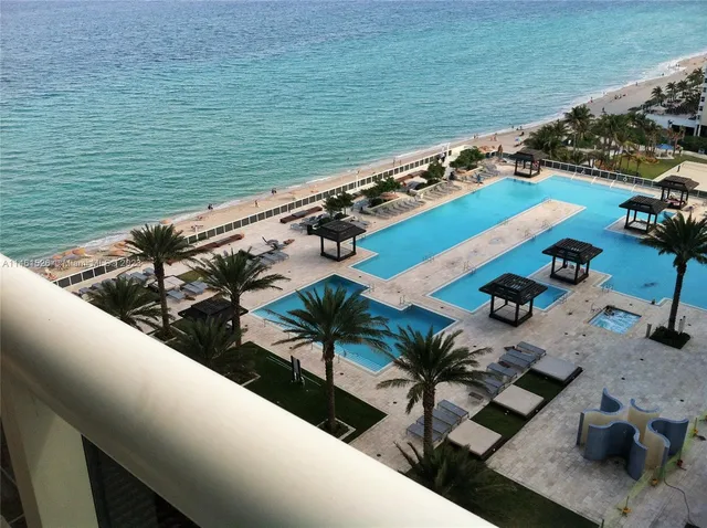 a view of swimming pool with outdoor seating