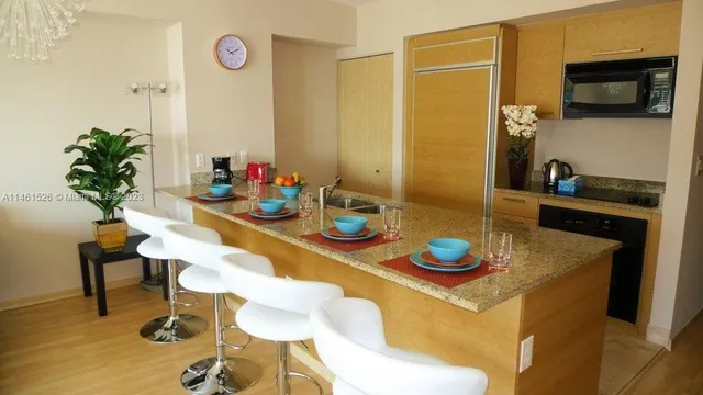 a kitchen with a table and chairs in it