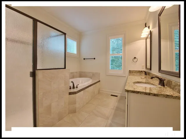 a bathroom with a sink and mirror