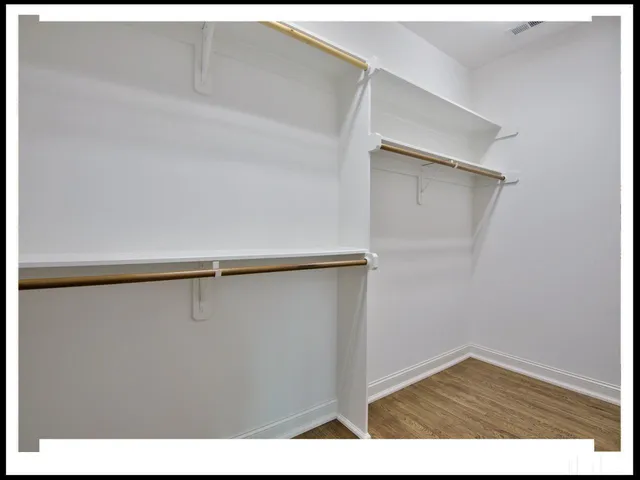 a view of an empty walk in closet