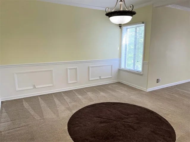 a view of a kitchen with a sink and a kitchen counter top