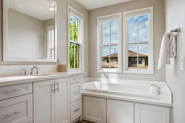 a bathroom with a sink and a window