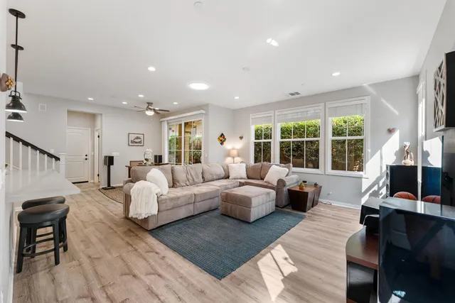 a living room with furniture and a large window