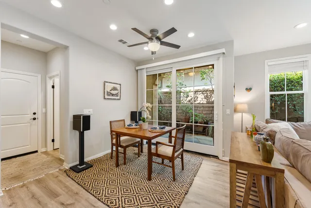 a workspace with wooden floor and a rug