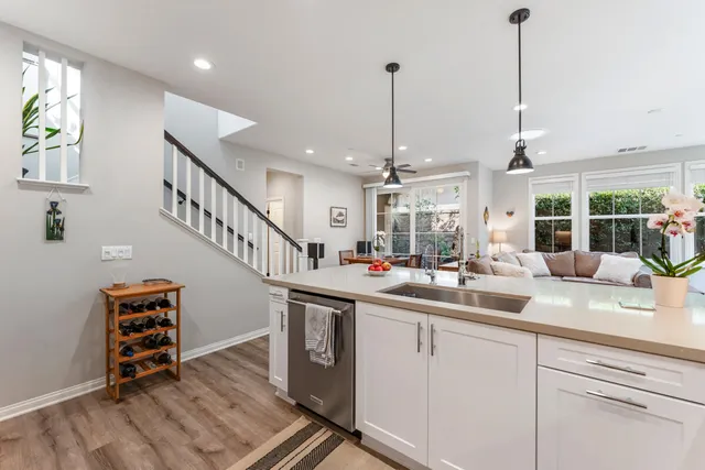 a kitchen with sink cabinets and window