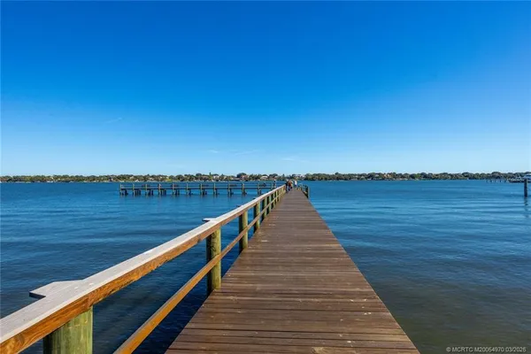 a view of wooden floor with a lake view