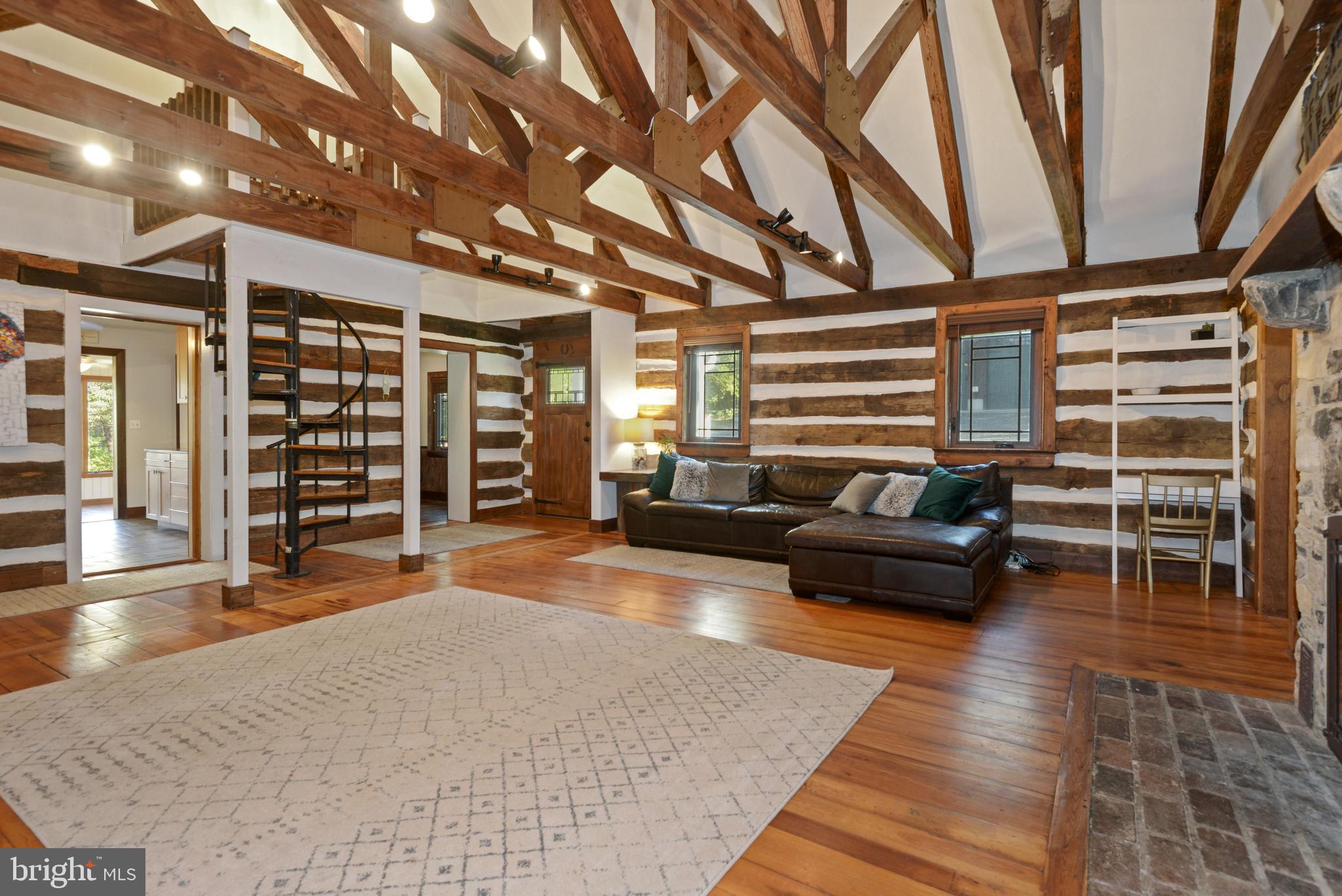 39852 Thomas Mill Road Leesburg, VA 20175 - Photo 17 of 40 Open living room with exposed beams