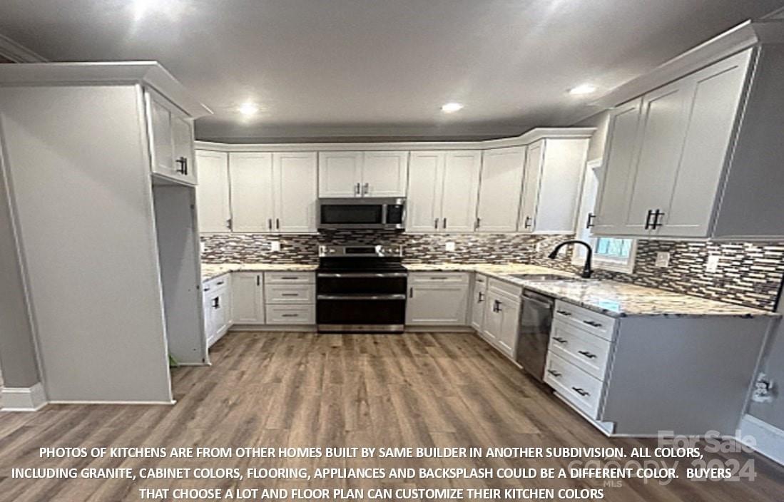 0 Wilson Court, Unit 12 Vale, NC 28168 - Photo 8 of 21 a kitchen with a sink a counter top space stainless steel appliances and cabinets